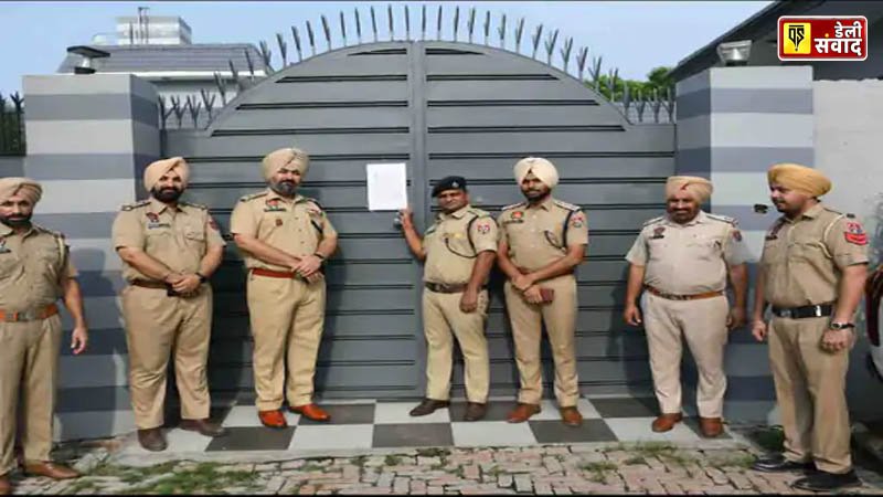 Police sealing the property of a drug smuggler in Ludhiana