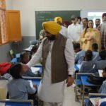 Cabinet minister Harbhajan Singh makes surprise visit to government schools and eats mid-day meal sitting with students